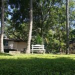 Image of AirBNB backyard with Sunset View villa in the background to left